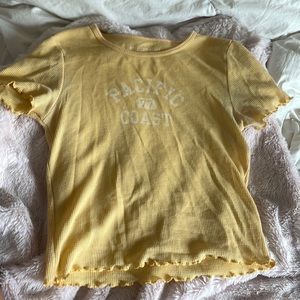 On the front it says PACIFIC 77 COAST. very cute crop top i just never wear it